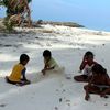 Maldives, Maafushi island, children playing in a sand